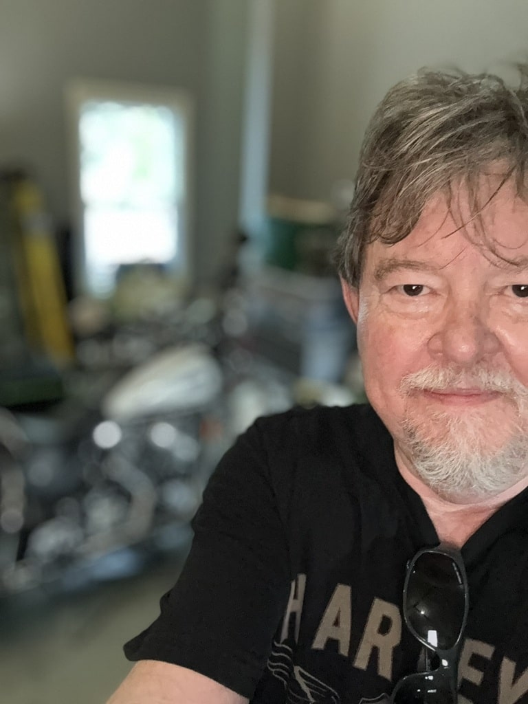 Greg in the garage with his old Harley in Arab, Alabama