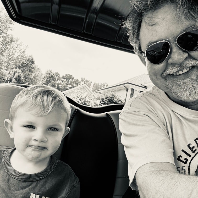 Fletcher and Papa riding the golf cart