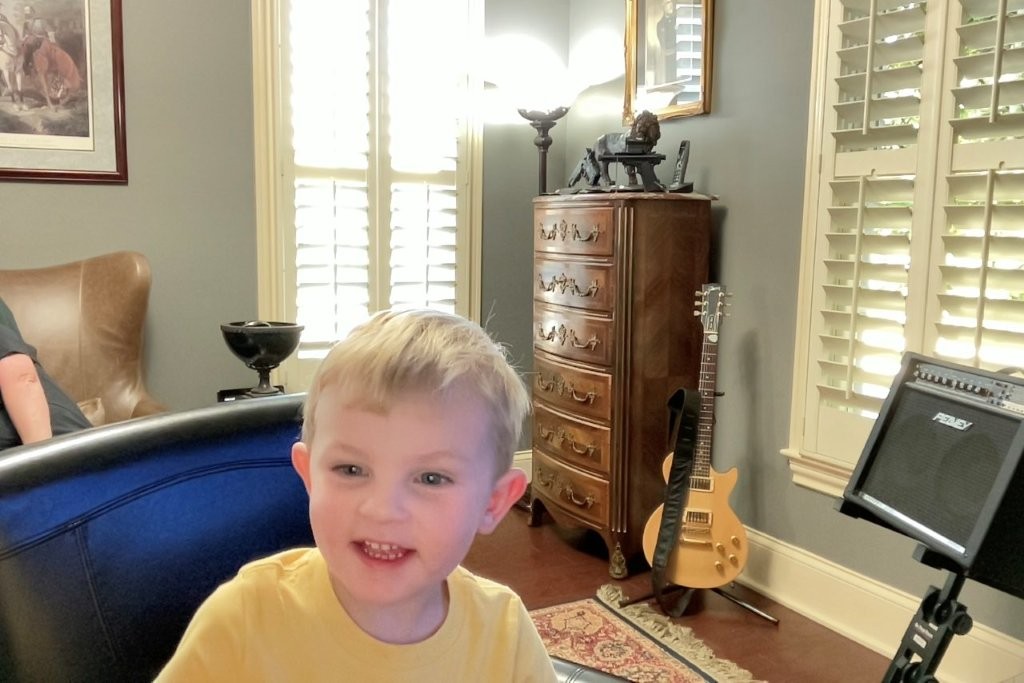Fletcher taking selfies with photo booth on Papa's Mac