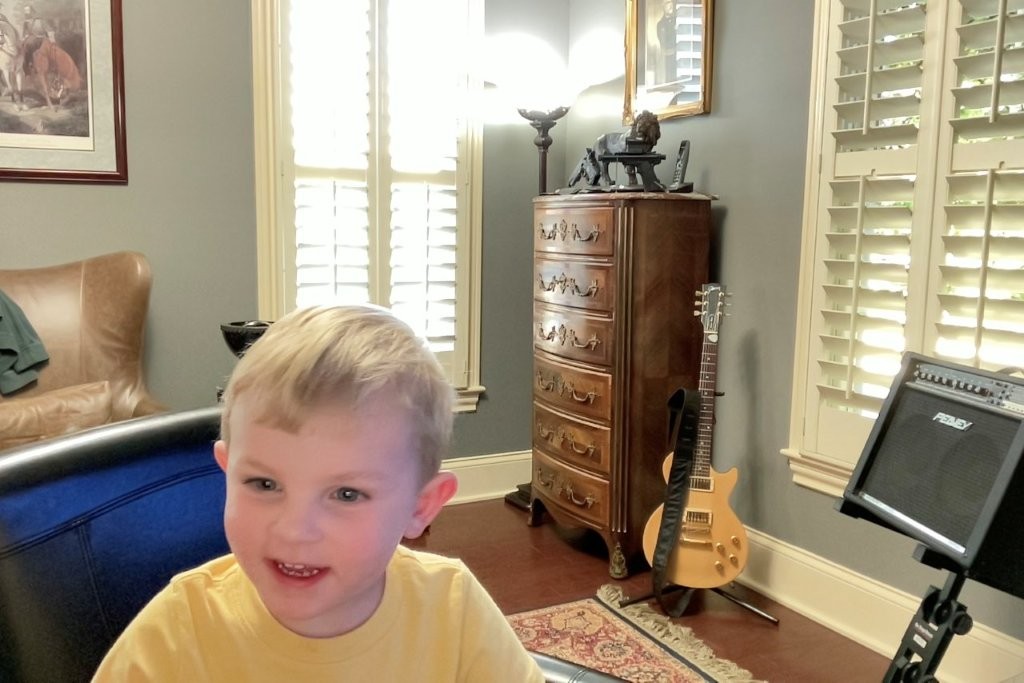 Fletcher taking selfies with photo booth on Papa's Mac