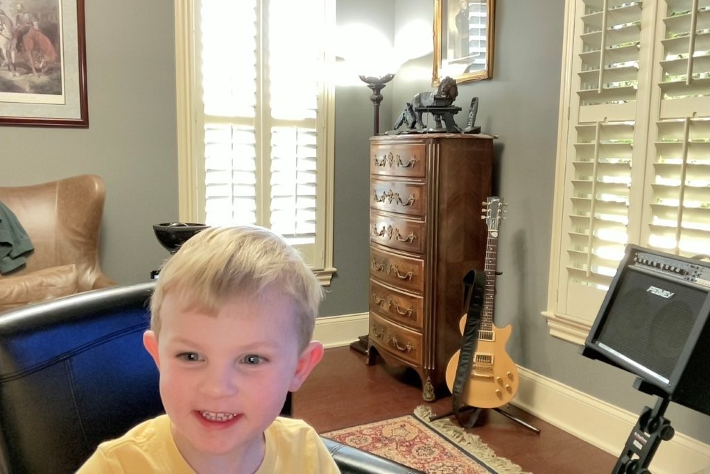 Fletcher taking selfies with photo booth on Papa's Mac
