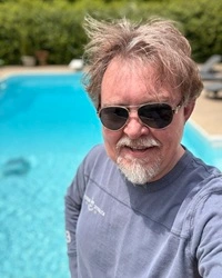 Greg cleaning the swimming pool