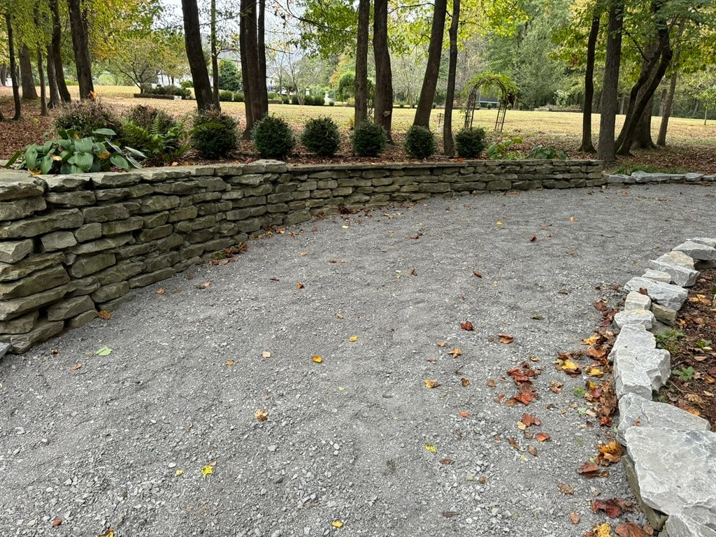 Stone wall and gravel walking trail