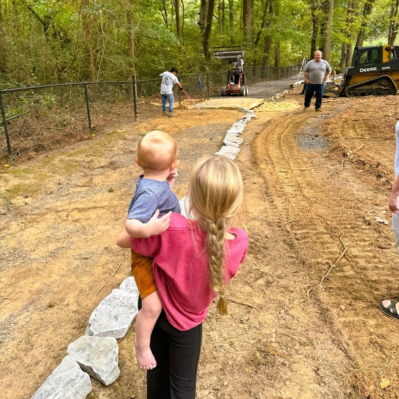 Kynzley and Fletcher checking out the walking trail progress